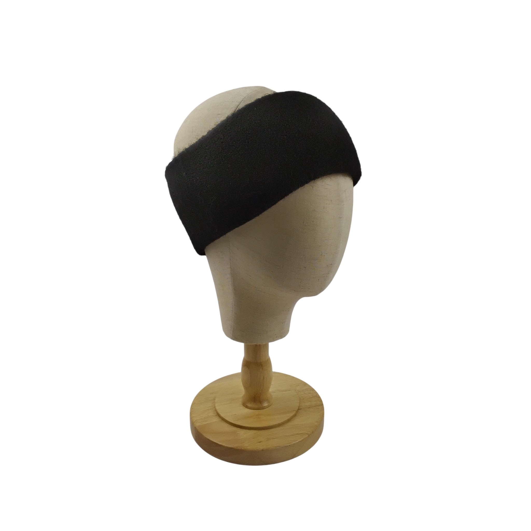 Black headband on a mannequin head against a white background