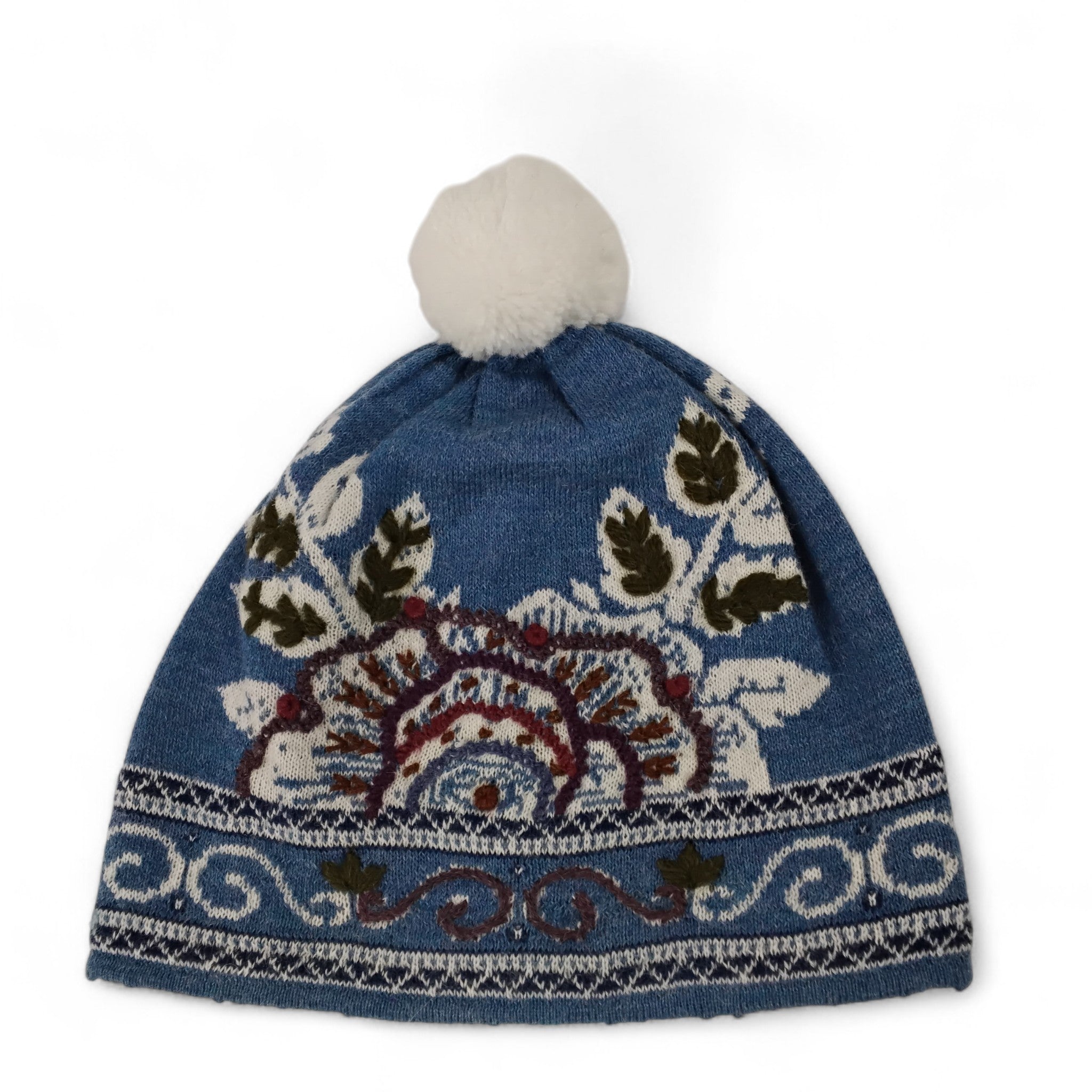 Knitted hat with a blue pattern on a white background